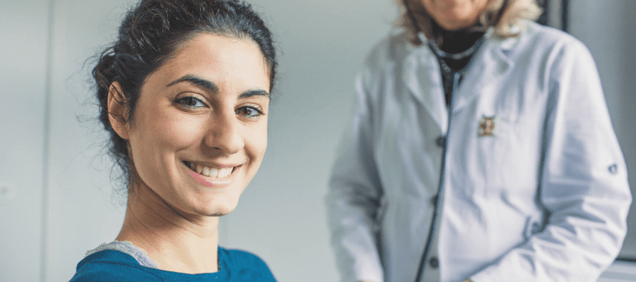 A woman and a doctor in an office