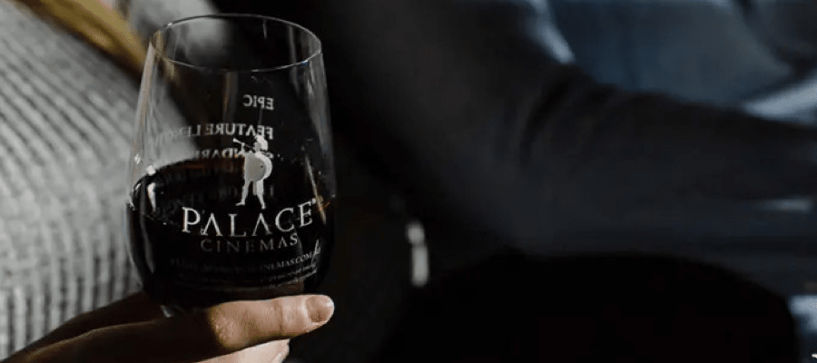 A wine glass etched with the Palace Cinemas logo